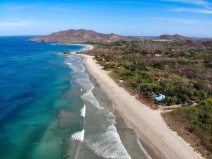 an aerial view of a beach and the ocean at Villa Serenity 6 bedroom - 1 minute to the beach in Santa Cruz