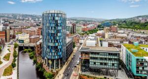 an aerial view of a city with a tall building at Chic Central, Relaxing, Restful, Retreat, Heated Floors, High Ceiling, Open Plan, City Centre, 1BR in Sheffield