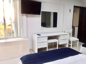 TV a/nebo společenská místnost v ubytování Marina Suites by Andiani Travel + 37 fotografií