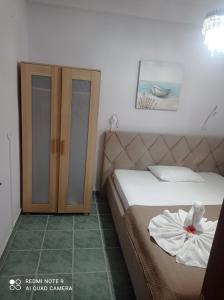 A bed or beds in a room at "By The Sea" Family apartments