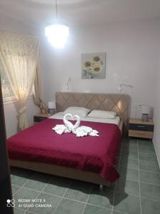 A bed or beds in a room at "By The Sea" Family apartments