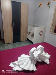 A bed or beds in a room at "By The Sea" Family apartments