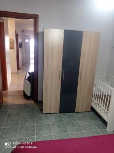 A bed or beds in a room at "By The Sea" Family apartments
