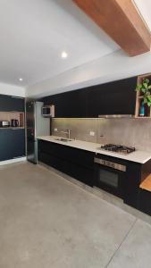 Køkken eller tekøkken på Aloha.miento + 2 billeder