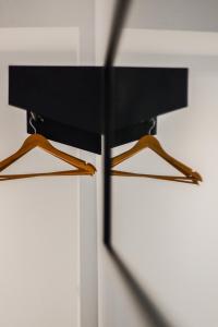 a pair of hangers hanging on a wall at Apartment Place Stanislas 3 in Nancy