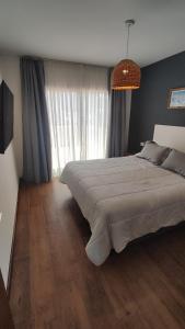 En eller flere senge i et værelse på Aloha.miento