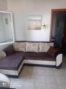 A seating area at "By The Sea" Family apartments