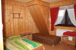 Posteľ alebo postele v izbe v ubytovaní Pokoje Zakopane