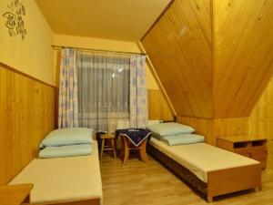 Posteľ alebo postele v izbe v ubytovaní Pokoje Zakopane