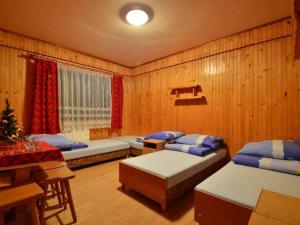Posteľ alebo postele v izbe v ubytovaní Pokoje Zakopane