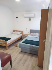 Postel nebo postele na pokoji v ubytování Prenoćište, sobe AN-KA