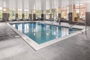 a large swimming pool in a hotel building at Residence Inn by Marriott Tuscaloosa in Tuscaloosa