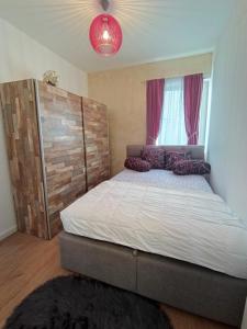 Postel nebo postele na pokoji v ubytování Gold Apartman