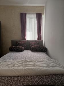 Postel nebo postele na pokoji v ubytování Gold Apartman
