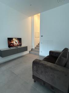 a living room with a couch and a fireplace at Diamond luxury house in Monopoli