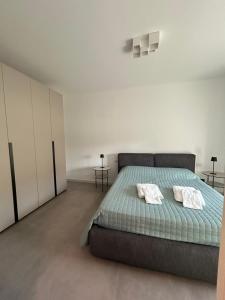 a bedroom with a bed with two pillows on it at Diamond luxury house in Monopoli