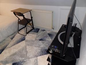 TV a/nebo společenská místnost v ubytování Byron View House R6