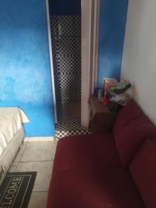 a bedroom with a bed and a bathroom with a shower at Lais in Lençóis