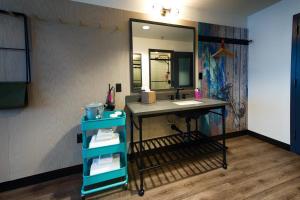 a bathroom with a sink and a mirror at MOXY New Orleans Downtown/French Quarter Area in New Orleans