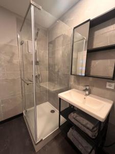 a bathroom with a shower and a sink at Glamping Liptov in Liptovský Trnovec