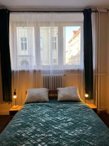 Postel nebo postele na pokoji v ubytování Tom Hostel