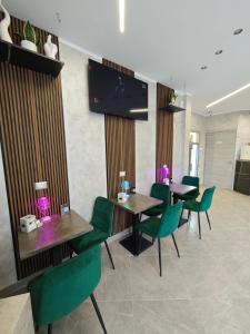 TV a/nebo společenská místnost v ubytování Hotel Movida