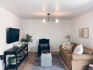 a living room with a couch and a table at Beautiful Private Guest House in Arcadia in Phoenix