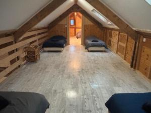 a room with three beds in a attic at Idéal we, vacances travail in Sainte-Hélène-sur-Isère
