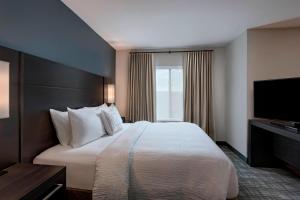 Postel nebo postele na pokoji v ubytování Residence Inn by Marriott St. Paul Downtown + 20 fotografií