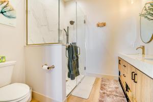 a bathroom with a shower and a toilet at 1 Block to Lake City Marina Condo with Rooftop Deck in Lake City +28 photos