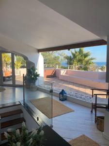 a living room with a view of the ocean at Soltroia Dunas House in Troia