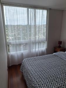 Ένα ή περισσότερα κρεβάτια σε δωμάτιο στο apartamento entero en Valparaíso +32 φωτογραφίες