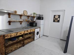 Kuchyň nebo kuchyňský kout v ubytování La Maison du Bonheur + 1 fotografie