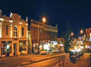 a city street at night with cars and buildings at Lizzy's Hideaway, Close to City in West Hobart