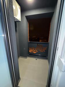 a room with a window with a view of the city at Banja Luka Comfort - Wifi & Parking in Banja Luka +2 photos