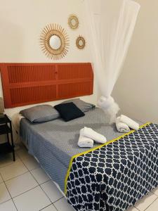 Voodi või voodid majutusasutuse Villa Sous le Manguier-Anse Bertrand 5min plage toas