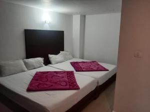 Voodi või voodid majutusasutuse The Green Regency Anex toas