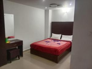 Voodi või voodid majutusasutuse The Green Regency Anex toas