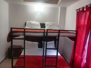 Voodi või voodid majutusasutuse The Green Regency Anex toas