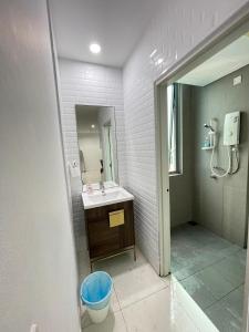 a bathroom with a sink and a shower at SP Home At Mercu Summer Suites in Kuala Lumpur
