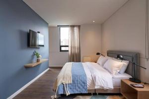Voodi või voodid majutusasutuse Caluce Apt 5A by LetoH toas