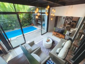 an aerial view of a living room with a pool at Villa Habibi in Uluwatu
