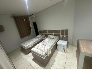 Postel nebo postele na pokoji v ubytování Hotel Maraja 9 de julho