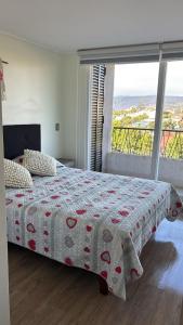 Ένα ή περισσότερα κρεβάτια σε δωμάτιο στο Departamento en Papudo