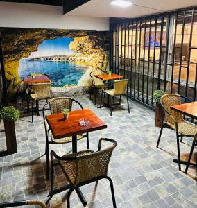 a patio with tables and chairs in a restaurant at Hostal Familiar 277 in Viña del Mar