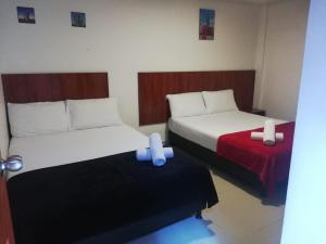 Postel nebo postele na pokoji v ubytování Hotel el cable pereira