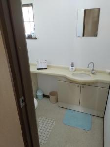 Koupelna v ubytování Kei Chia Private Lodging