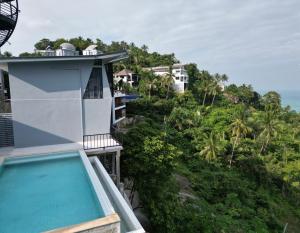 a view of a resort with a swimming pool at Scenery Sunrise in Chaweng Noi Beach