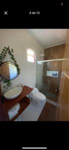 a bathroom with a toilet and a sink and a shower at Dila Beach House - Praia dos Algodões - Maraú in Praia dos Algodões +10 photos