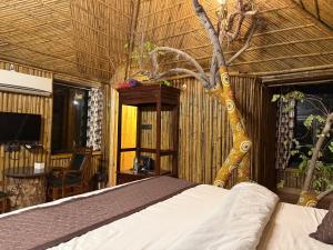 TV a/nebo společenská místnost v ubytování Hotel Green Heaven Resort